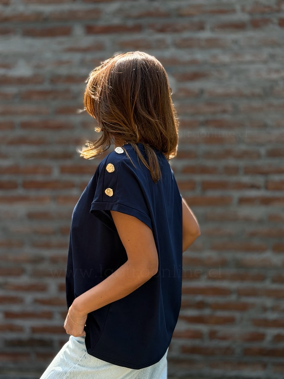 Polera botón hombro azul